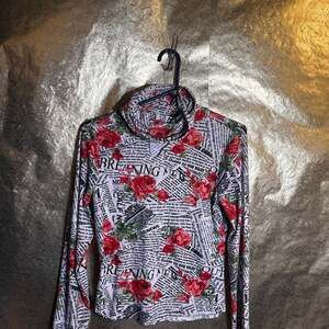 Almost famous size large long sleeve rose newspaper print